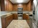 Spacious kitchen with wood cabinets, granite countertops, and stainless steel appliances at 307 Westfield Dr, Dunn, NC 28334