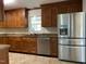 Modern kitchen with stainless steel appliances and ample wood cabinetry at 307 Westfield Dr, Dunn, NC 28334