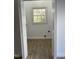 Laundry room with built-in shelving and vinyl flooring at 307 Westfield Dr, Dunn, NC 28334
