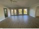 Bright living room with hardwood floors and French doors leading to patio at 307 Westfield Dr, Dunn, NC 28334
