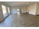 Spacious living room with hardwood floors, fireplace, and white brick wall at 307 Westfield Dr, Dunn, NC 28334