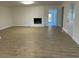 Spacious living area with hardwood floors and fireplace at 307 Westfield Dr, Dunn, NC 28334