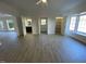 Bright living room features hardwood floors and access to other rooms at 307 Westfield Dr, Dunn, NC 28334