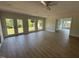 Bright and airy living room with wood flooring, neutral colors, and outdoor access at 307 Westfield Dr, Dunn, NC 28334