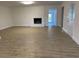 Open living room with fireplace, hardwood floors, and bright natural light at 307 Westfield Dr, Dunn, NC 28334
