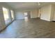 Open living room with hardwood floors and brick fireplace at 307 Westfield Dr, Dunn, NC 28334