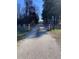 A gravel walking path with posts on either side, surrounded by trees and grass at 307 Westfield Dr, Dunn, NC 28334