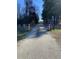 Paved walking trail with trees and park access at 307 Westfield Dr, Dunn, NC 28334