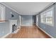 Hardwood floors and gray walls in this living room, with a view into the kitchen at 318 Asbury Church Rd, Sanford, NC 27330