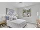 Bedroom featuring a window with treed views, neutral colors and decor at 3400 Amelia Grace Dr # 46, Fuquay Varina, NC 27526