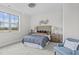 Bedroom featuring a large window, natural light, wood furnishings and neutral colors at 3400 Amelia Grace Dr # 46, Fuquay Varina, NC 27526