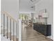 Inviting entryway with wood floors, decorative console table, and view into the dining area at 3400 Amelia Grace Dr # 46, Fuquay Varina, NC 27526