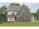 Two-story home featuring mixed siding, a covered porch, and professionally landscaped yard at 3400 Amelia Grace Dr # 46, Fuquay Varina, NC 27526