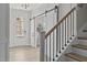 Bright foyer with white trim, modern sliding doors, and light wood-look floors at 3400 Amelia Grace Dr # 46, Fuquay Varina, NC 27526