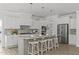 Kitchen features modern stainless steel appliances, white cabinets, a large island and barstool seating at 3400 Amelia Grace Dr # 46, Fuquay Varina, NC 27526