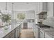 Beautiful kitchen featuring stainless steel appliances, granite countertops, and a stylish island with pendant lighting at 3400 Amelia Grace Dr # 46, Fuquay Varina, NC 27526
