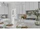Bright kitchen with granite countertops, stainless appliances, decorative lighting, and a center island at 3400 Amelia Grace Dr # 46, Fuquay Varina, NC 27526