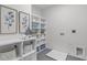 Organized laundry room featuring open shelving, decor and ample storage for supplies at 3400 Amelia Grace Dr # 46, Fuquay Varina, NC 27526