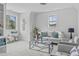 Well-lit living area with a comfortable sofa, decorative pillows, and a modern glass coffee table at 3400 Amelia Grace Dr # 46, Fuquay Varina, NC 27526