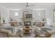 Bright living room with fireplace, built-in shelving, and comfortable seating arrangement at 3400 Amelia Grace Dr # 46, Fuquay Varina, NC 27526