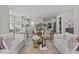 Open-concept living room with a light color palette and views into the spacious kitchen and dining area at 3400 Amelia Grace Dr # 46, Fuquay Varina, NC 27526