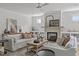 Spacious living room featuring a fireplace with shelving and ample seating at 3400 Amelia Grace Dr # 46, Fuquay Varina, NC 27526