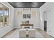 Bright office featuring a striking dark wood ceiling, modern chandelier, and ample natural light at 3400 Amelia Grace Dr # 46, Fuquay Varina, NC 27526