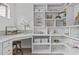 Spacious pantry features white cabinets and shelving, offering ample storage for kitchen essentials at 3400 Amelia Grace Dr # 46, Fuquay Varina, NC 27526