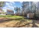 Large backyard with shed and house view at 405 Barewood Dr, Four Oaks, NC 27524