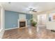 Living room with hardwood floors, fireplace, and access to kitchen at 405 Barewood Dr, Four Oaks, NC 27524