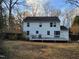 View of the backyard and deck, surrounded by trees at 4300 Hickory Ridge Dr, Raleigh, NC 27609