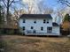 Backyard view of a two-story home with a deck and fenced yard at 4300 Hickory Ridge Dr, Raleigh, NC 27609