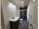 Modern bathroom featuring a glass-enclosed shower and a stylish dark wood vanity with a white countertop at 4300 Hickory Ridge Dr, Raleigh, NC 27609