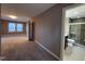Bedroom leading to bathroom featuring a modern vanity, toilet, and glass-enclosed shower at 4300 Hickory Ridge Dr, Raleigh, NC 27609