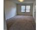 Inviting bedroom featuring neutral walls, plush carpet, and ample natural light at 4300 Hickory Ridge Dr, Raleigh, NC 27609