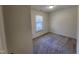 Bedroom featuring carpeting, light walls, and a window with blinds at 4300 Hickory Ridge Dr, Raleigh, NC 27609