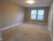 Bedroom showcasing neutral walls, plush carpet, and large windows for natural light at 4300 Hickory Ridge Dr, Raleigh, NC 27609