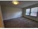 Bedroom with carpet, light walls, and natural light from two windows at 4300 Hickory Ridge Dr, Raleigh, NC 27609