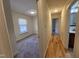 View of bedroom and hallway entrance showing carpeting and natural light from the window at 4300 Hickory Ridge Dr, Raleigh, NC 27609