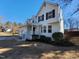 Inviting two-story home with manicured landscaping, features a bay window and attached two-car garage at 4300 Hickory Ridge Dr, Raleigh, NC 27609
