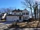 Charming two-story traditional home featuring a manicured front yard and a three-car garage at 4300 Hickory Ridge Dr, Raleigh, NC 27609