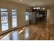 Open-concept kitchen with stainless steel appliances and walk-out patio at 4300 Hickory Ridge Dr, Raleigh, NC 27609