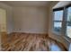 Open-concept living room featuring bright light and hardwood floors at 4300 Hickory Ridge Dr, Raleigh, NC 27609