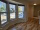Bright living area with a large bay window and hardwood floors at 4300 Hickory Ridge Dr, Raleigh, NC 27609