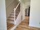 A staircase leading to the upper level at 4300 Hickory Ridge Dr, Raleigh, NC 27609