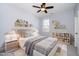 Charming bedroom featuring a cozy bed, stylish nightstands, and decorative shelves filled with toys and whimsical decor at 4538 Brighton Ridge Dr, Apex, NC 27539