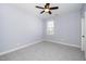 A well-lit bedroom featuring neutral walls, carpet, and a ceiling fan, offering a blank canvas for personalization at 4538 Brighton Ridge Dr, Apex, NC 27539
