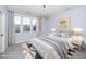 Comfortable bedroom with a chandelier, carpeted floors, and a large window at 4538 Brighton Ridge Dr, Apex, NC 27539