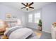 Staged bedroom featuring a comfortable bed, side tables, and windows, creating a cozy and inviting atmosphere at 4538 Brighton Ridge Dr, Apex, NC 27539