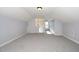 Large bonus room featuring neutral walls and plush carpet, offering a versatile space for entertainment and relaxation at 4538 Brighton Ridge Dr, Apex, NC 27539